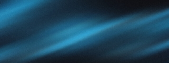 Abstract blue flowing light streaks on dark background