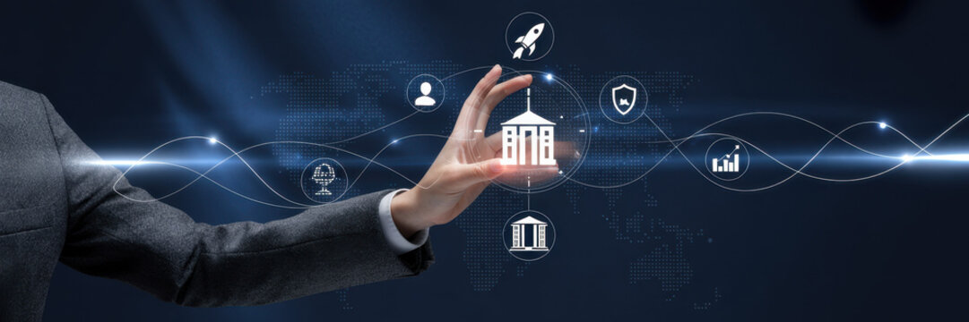 Hand interacting with digital icons representing business and technology on a dark blue background with light trails - Powered by Adobe