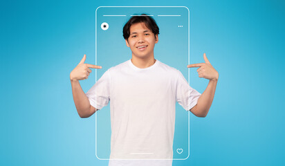 A young man stands in a bright blue setting, pointing at himself with a cheerful expression. This...