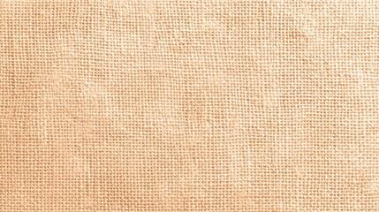 Fototapeta premium Soft beige burlap fabric displays a detailed weave pattern perfect for crafty projects and decor.