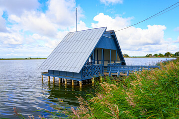 Obraz premium Wooden swan house in the Haapsalu forebay along the coast of the Baltic Sea on the west coast of Estonia