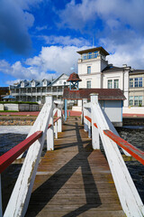 Fototapeta premium Wooden pier on the Haapsalu waterfront promenade along the Baltic Sea in a spa town on the west coast of Estonia