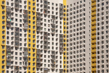 Contemporary multi-story residential building with a sharp corner facade under daylight
