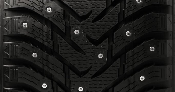 Studded winter tire background, loop-ready