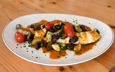 Fish Fillet with Roasted Vegetables and Savory Red Sauce