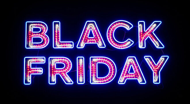 Catch the ultimate shopping frenzy with a vibrant neon 'Black Friday' sign glowing against a dark background, perfect for announcing amazing deals and sales events.