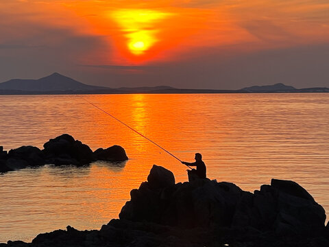Fisherman at Sunset in Greece