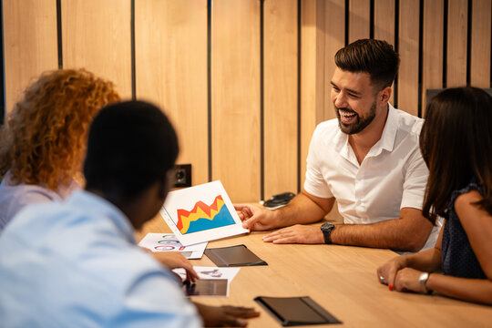 Business team presenting growth chart during creative meeting