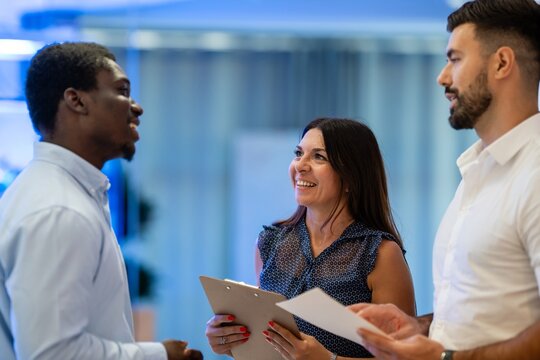 Group of diverse business professionals having discussion at workplace - Powered by Adobe