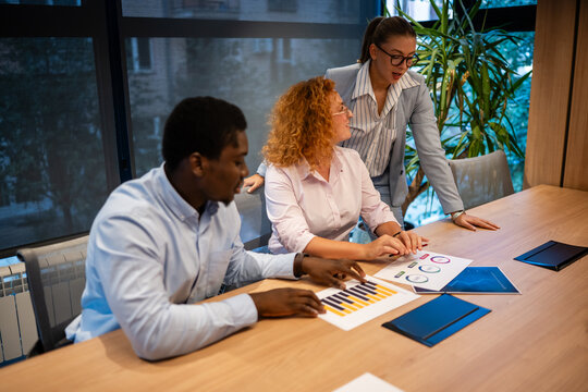 Business team discussing data analysis during meeting