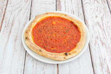 Irregular, charred bubbles on the thin crust are evidence of perfect wood-fired oven baking for...