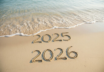 Transition from 2025 to 2026 Written in Sand with Ocean Wave Background