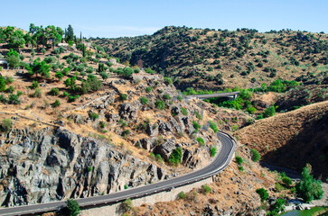 Winding road through hills of Toledo province, Spain.