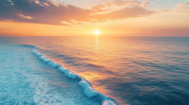 Serene ocean view during vibrant sunrise with gentle waves and colorful sky