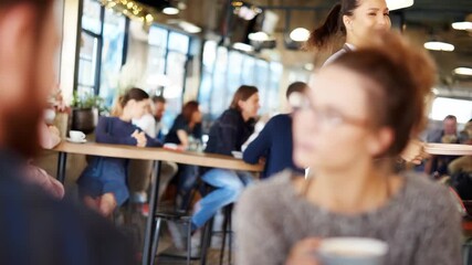 Medium shot of a gig worker happily discussing insurance options with a benefits advisor at a local cafe. - Powered by Adobe