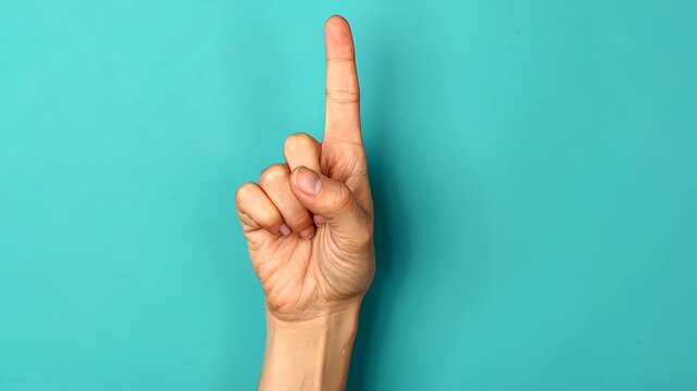 Upward Direction: A single, outstretched finger pointing skyward against a cool teal backdrop, conveying a clear message of direction and emphasis.