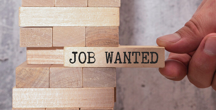 Small wooden easel with help wanted sign displaying