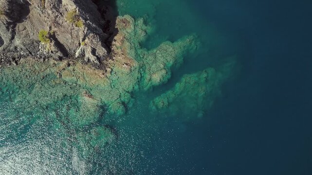 Aerial view of clear turquoise water and rocky coastline in Phaselis Bay Turkey