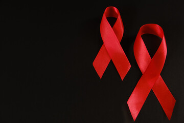 red ribbon symbol of World AIDS Day. Top view. Free copy space.