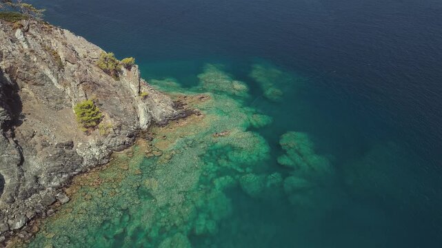 Aerial view of clear turquoise water and rocky coastline in Phaselis Bay Turkey