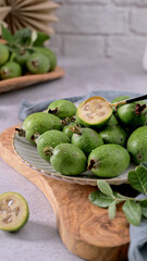Fresh Feijoa Fruits with a Spoon on a White Plate