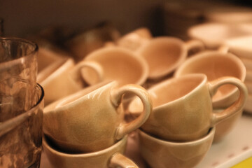 Warm light aesthetic filament lamp. Modern trendy lamp with vintage look and vibe. Living room decoration. Ceramic stand and a wire bulb. 