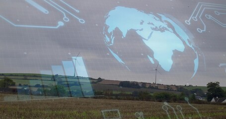 Showing farmland landscape with harvested field and wind turbines, displaying cyan globe overlay