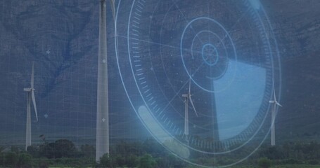 Rotating white wind turbines with three-bladed rotors occupying rural valley, showing blue HUD grid