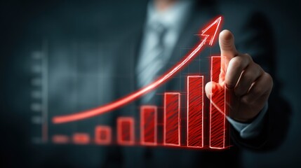 Businessman points to glowing red upward trending bar chart projection.