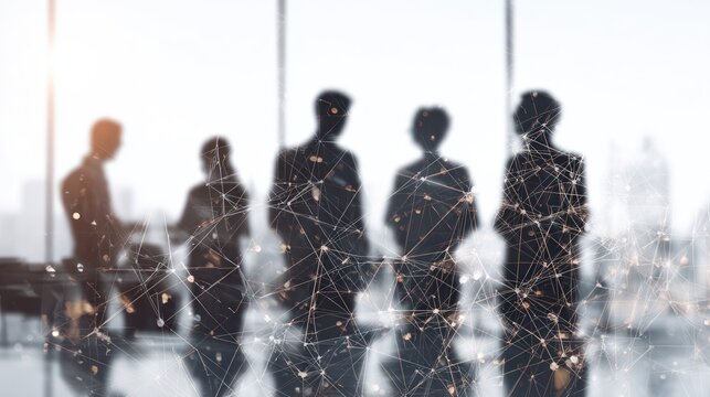 Silhouettes of business people overlaid with abstract network connections