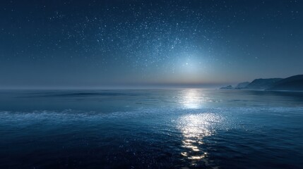 Starry night ocean scene with bright moonlight reflecting on water.