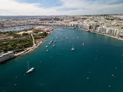 Malta Manoel Island panorama with historic Fort Manoel and Sliema creek yacht bay aerial drone view.

