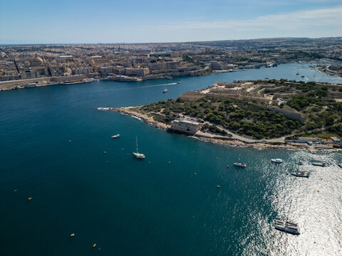 Malta Manoel Island panorama with historic Fort Manoel and Sliema creek yacht bay aerial drone view.
