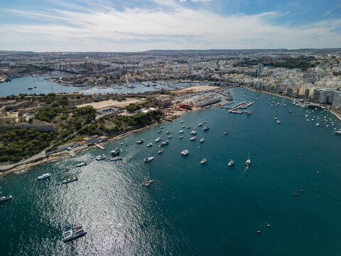 Malta Manoel Island panorama with historic Fort Manoel and Sliema creek yacht bay aerial drone view.
