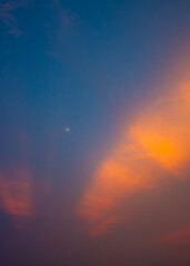Dawn sky with sunrise rays warming the hazy air