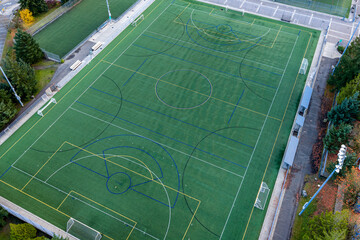 Aerial View Of A Multi‑Sport Synthetic Turf Field With Complex Line Markings And Goals