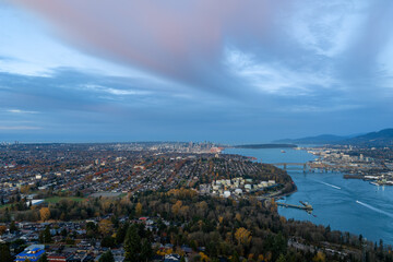 Panoramic Aerial View Of Burnaby And Vancouver Skyline Over Fraser River At Dusk