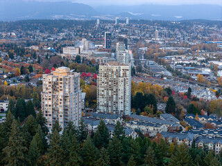 Fototapeta premium Aerial Cityscape of New Westminster: Autumn High-Rises, Trees, and River City in BC