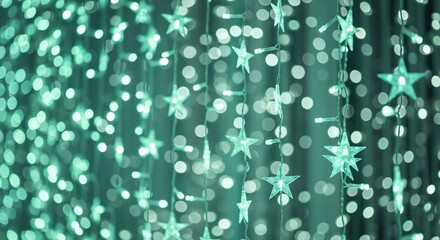 Bright teal star-shaped fairy lights creating a magical bokeh effect, perfect for festive holiday decorations or abstract backgrounds.