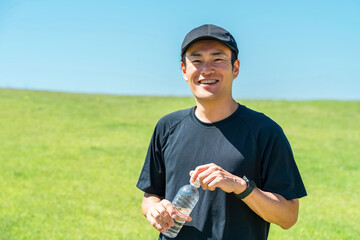 Middle-aged men hydrating during exercise, training, sports, and workouts
