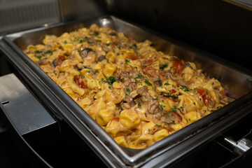 Serving pan with mushroom pasta. Creamy Mushroom Pasta.