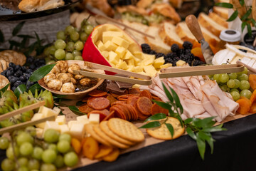 Large Charcuterie Board at an event with variety of finger foods