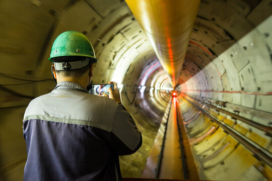 Soft focus and blurred lighting background of engineer or technician control to take a photo. Underground tunnel infrastructure. Transport pipeline by Tunnel Boring Machine for electric train subway