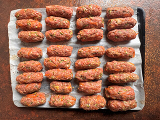 directly above shot of healthy food preparing homemade meal, skinless sausage made with mince meat 