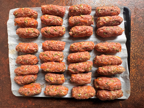 directly above shot of healthy food preparing homemade meal, skinless sausage made with mince meat 