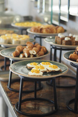 Delicious breakfast spread with pastries and eggs displayed