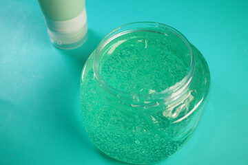 A clear jar filled with hair gel.