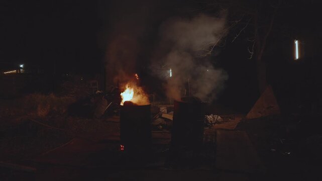 Barrels of garbage are burning, garbage is burning in barrels