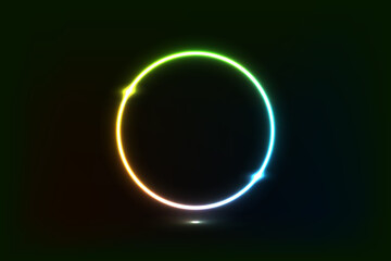 A glowing, multicolored neon ring with a gradient from yellow to green to blue, set against a dark background. Abstract, futuristic, and luminous.