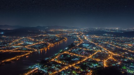 Obraz premium Aerial night skyline over a tropical city in Thailand, starry sky and river reflections